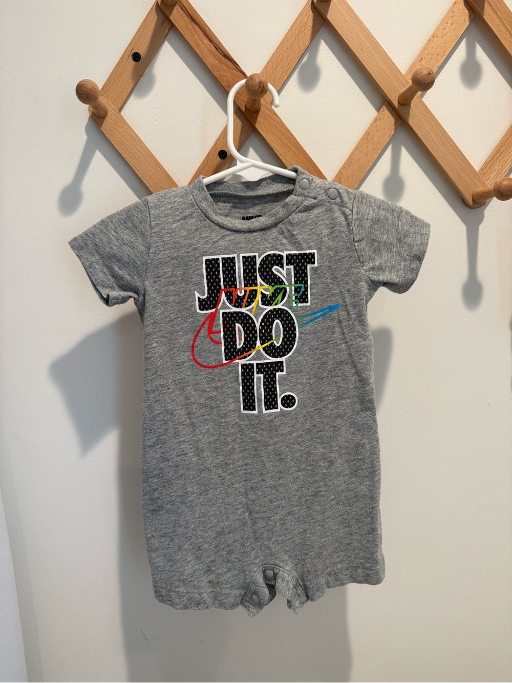 Nike Grey Baby Romper with Multicolor Swoosh "Just Do It."